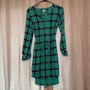 Green dress with pattern.